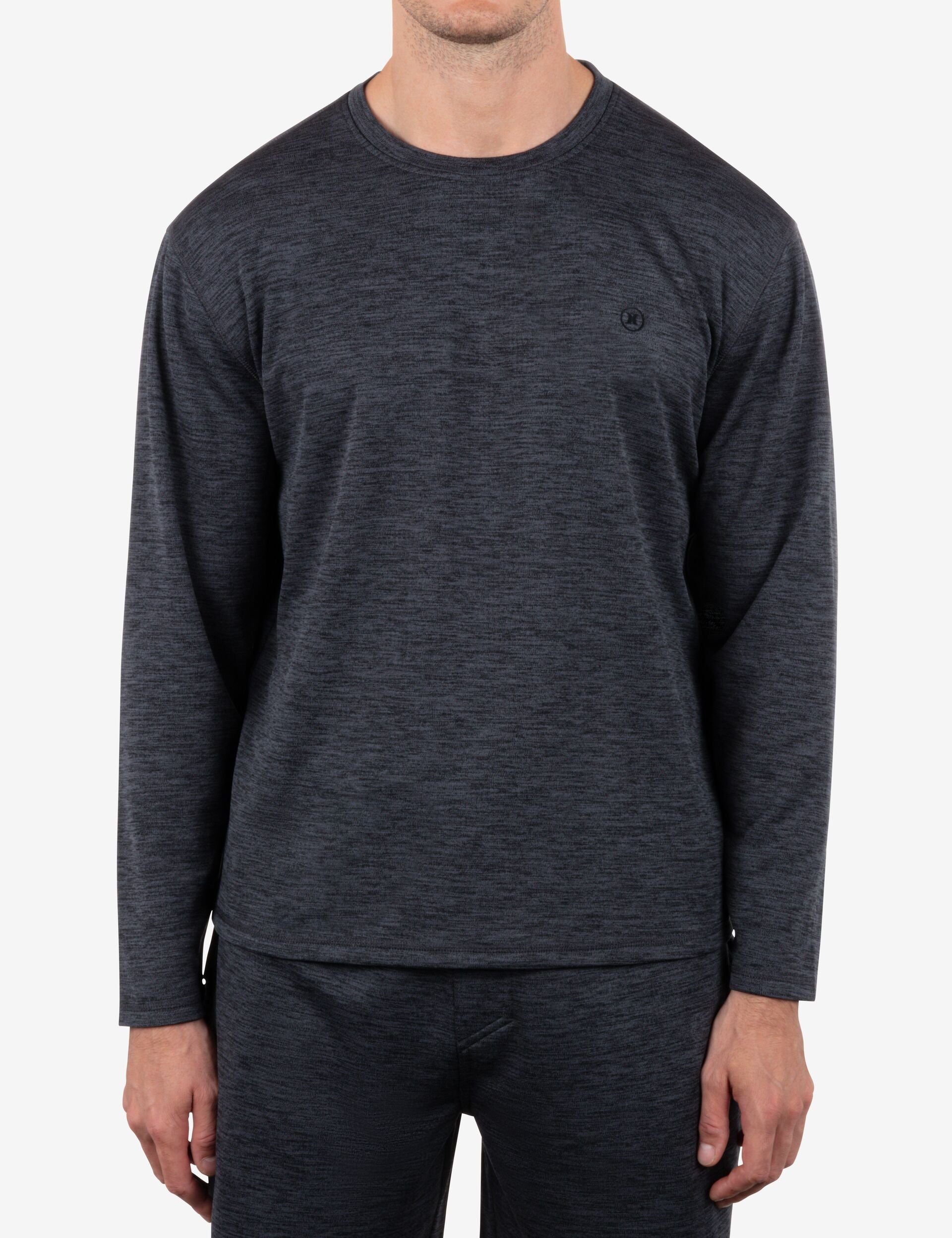 Dark gray long-sleeve shirt worn by a person on a white background
