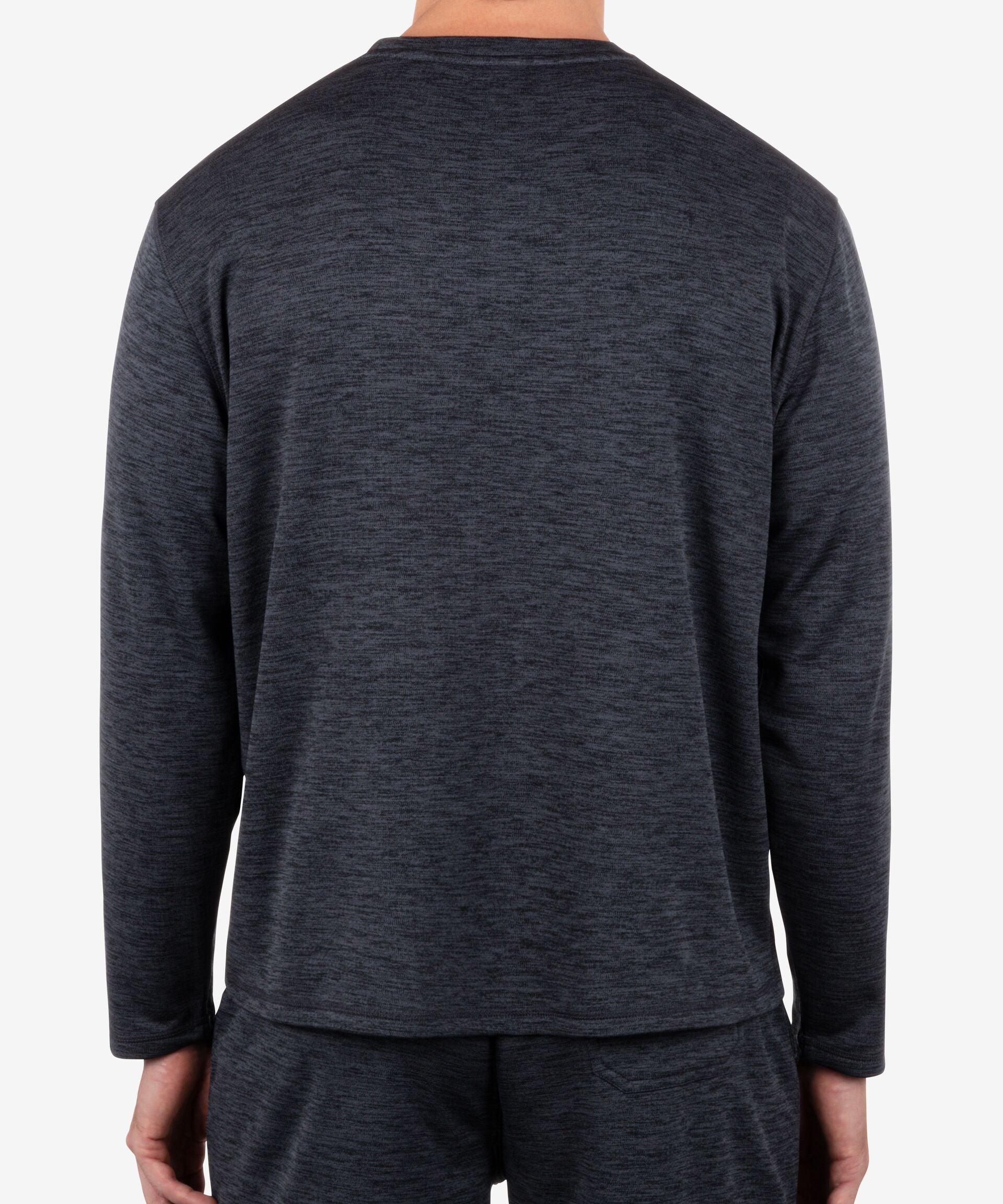 Person wearing a dark gray long-sleeve shirt on a white background