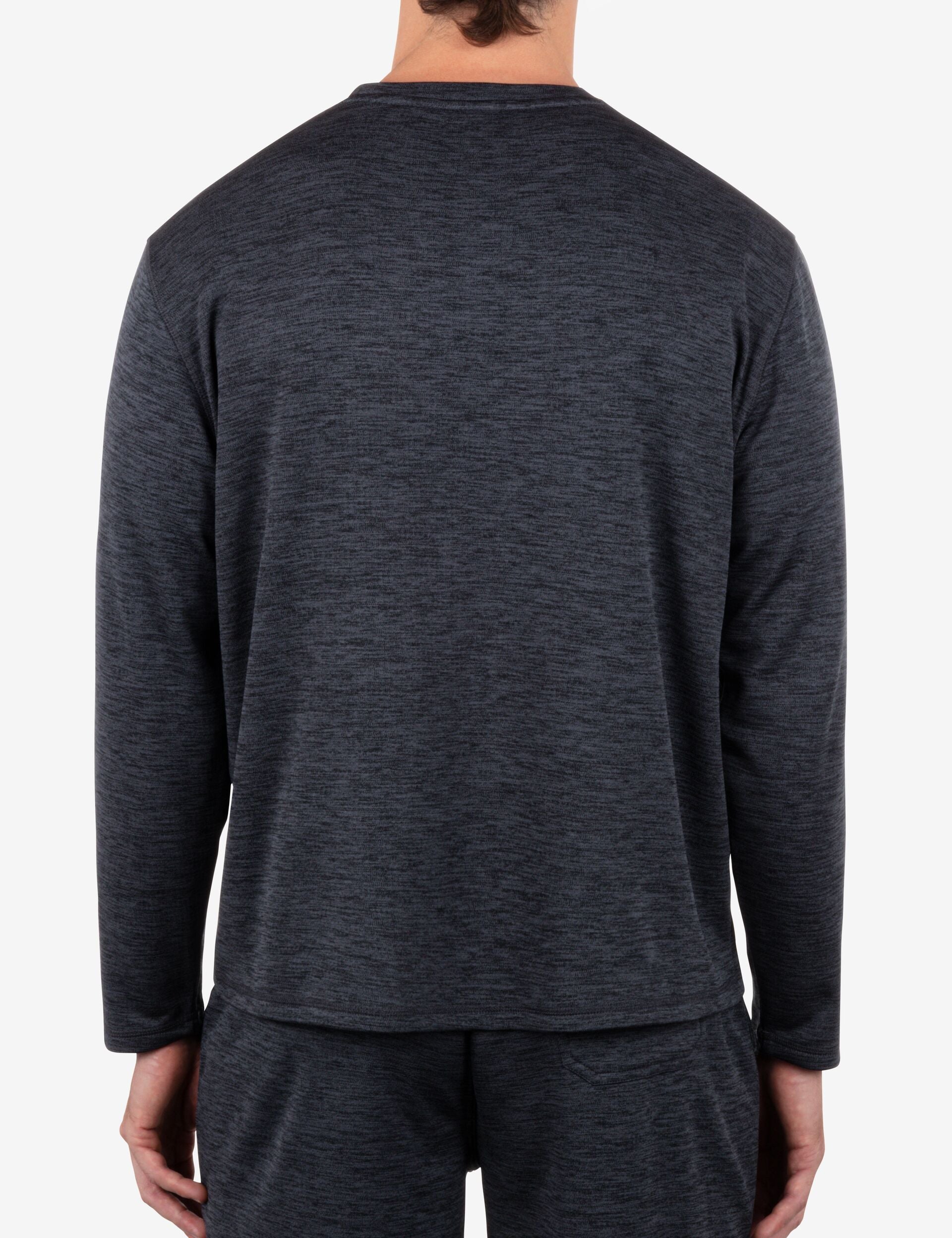 Person wearing a dark gray long-sleeve shirt on a white background