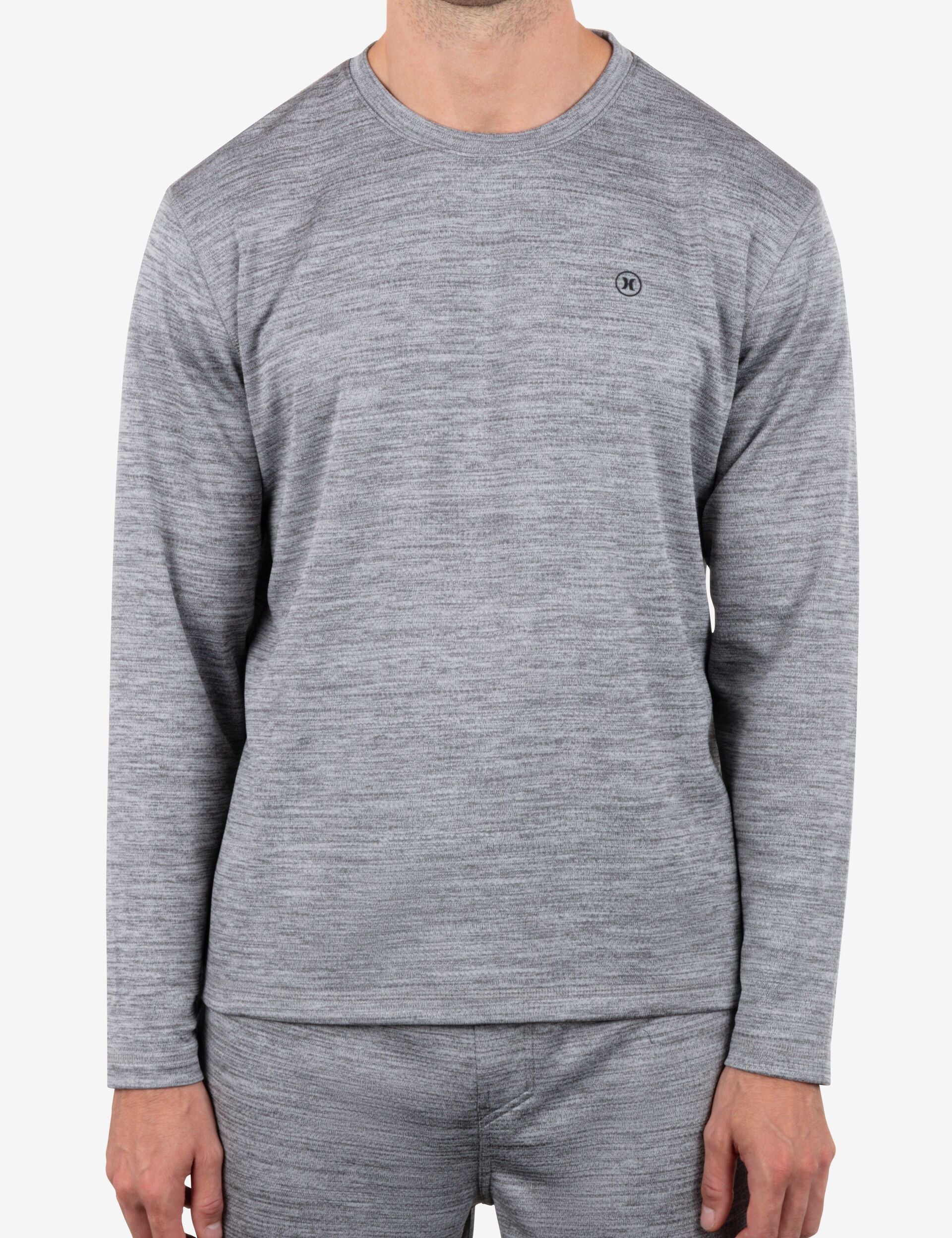 Person wearing a gray long-sleeve shirt and pants on a white background