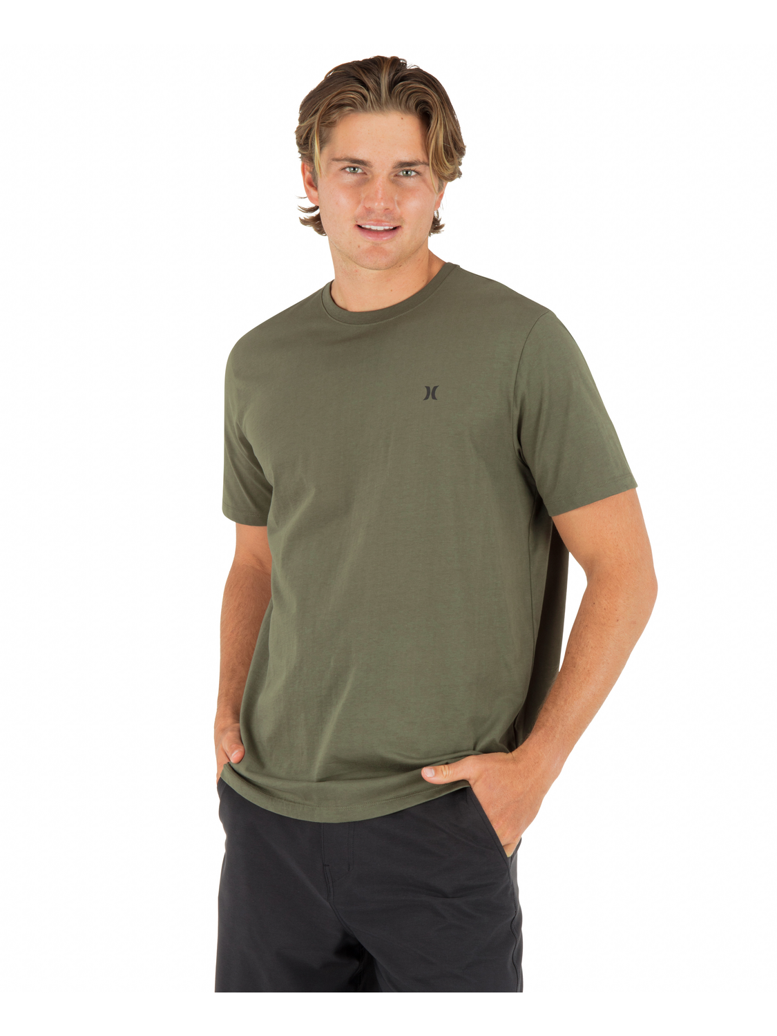 Man wearing a green t-shirt with a small Hurley logo on a white background