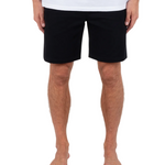 Person wearing black shorts and a white shirt on a white background