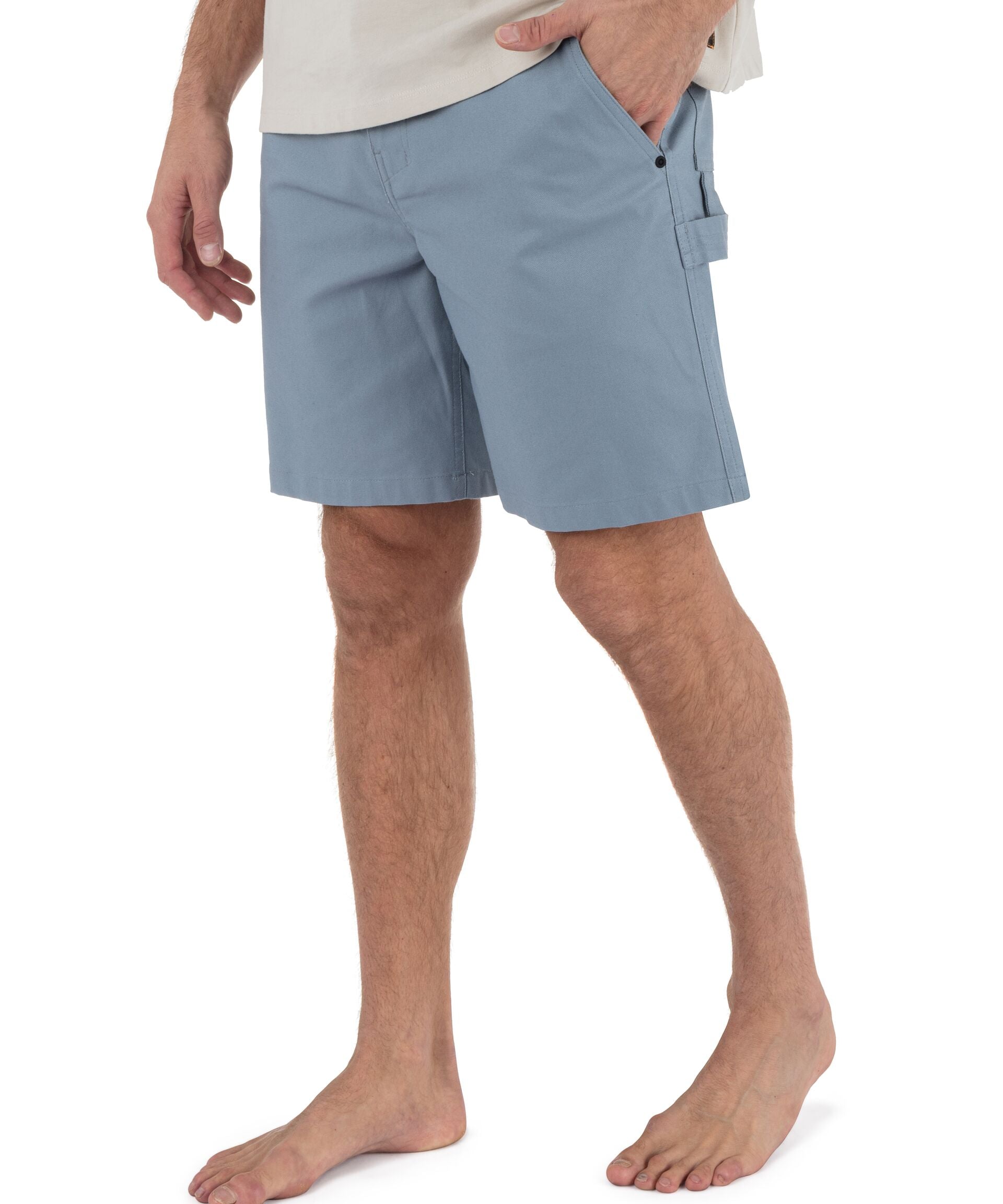 Person wearing light blue shorts on a white background