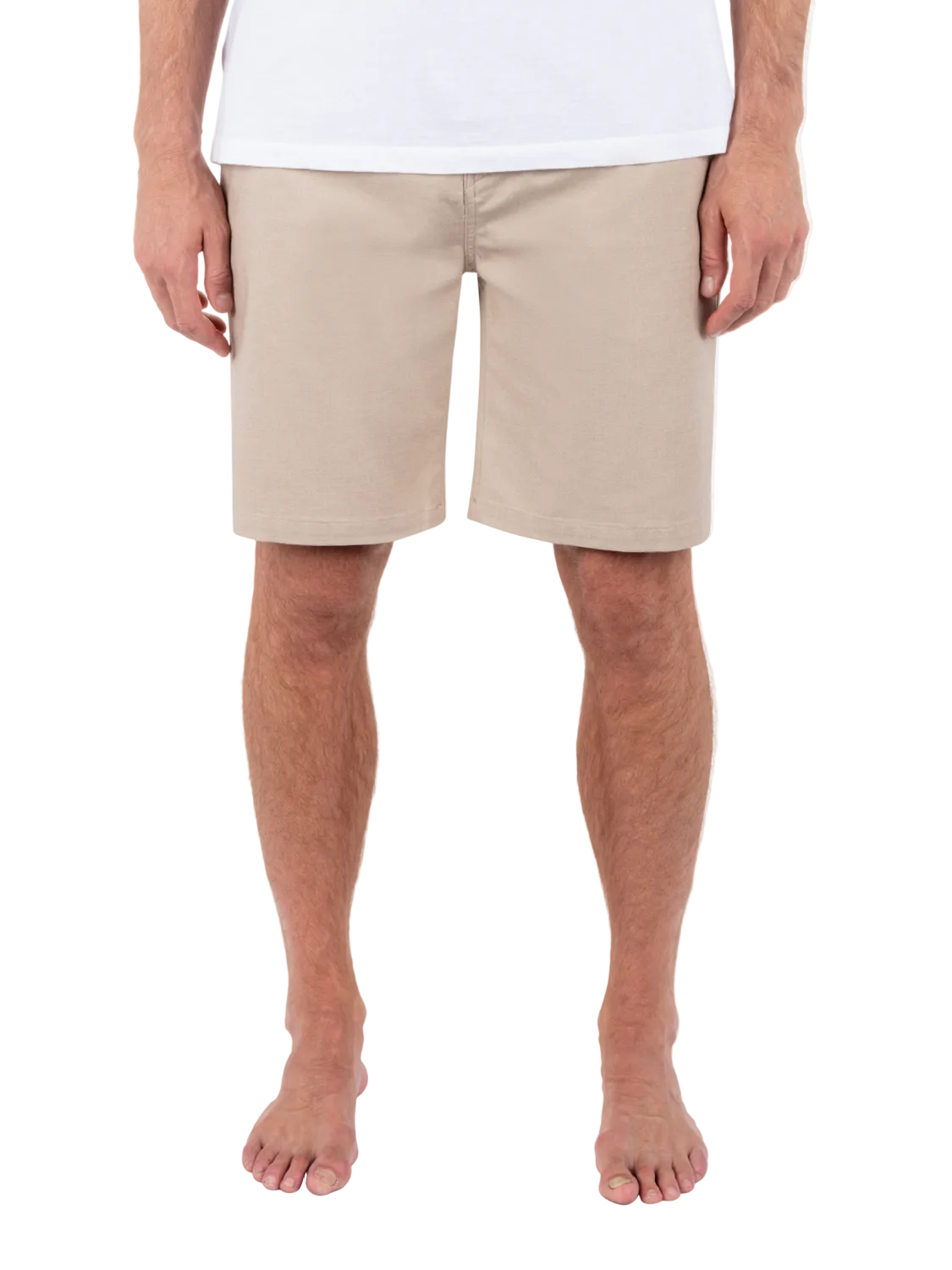 Person wearing beige shorts on a white background