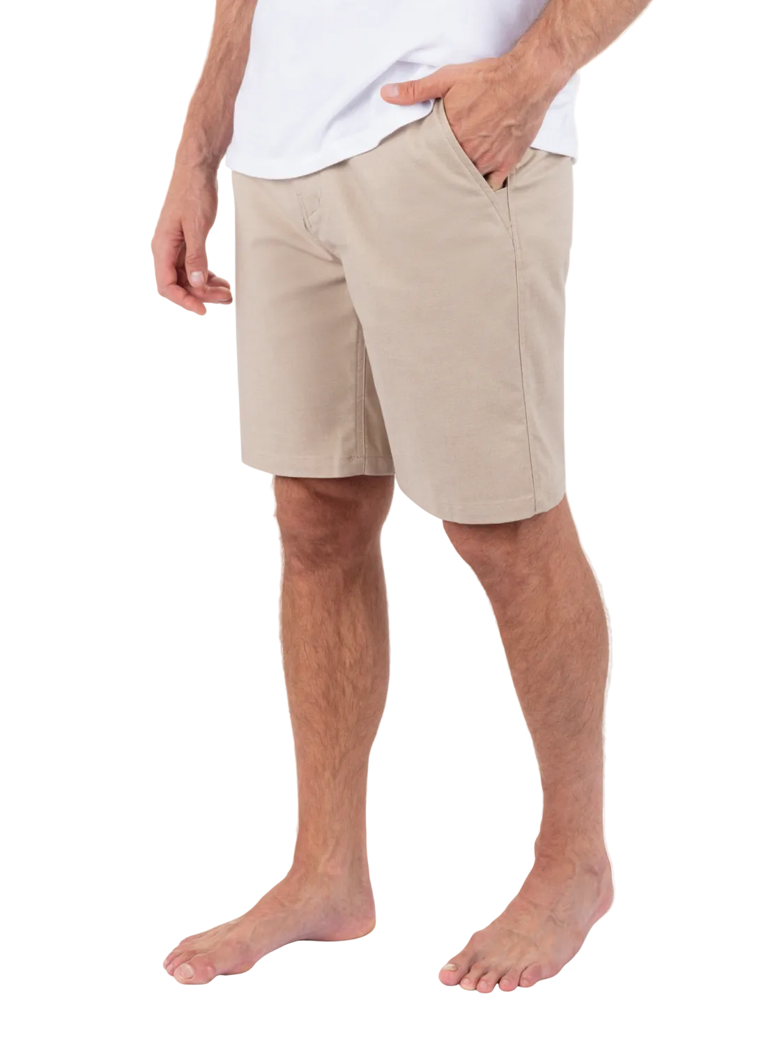 Person wearing beige shorts on a white background