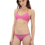 Woman wearing a pink bikini on a white background