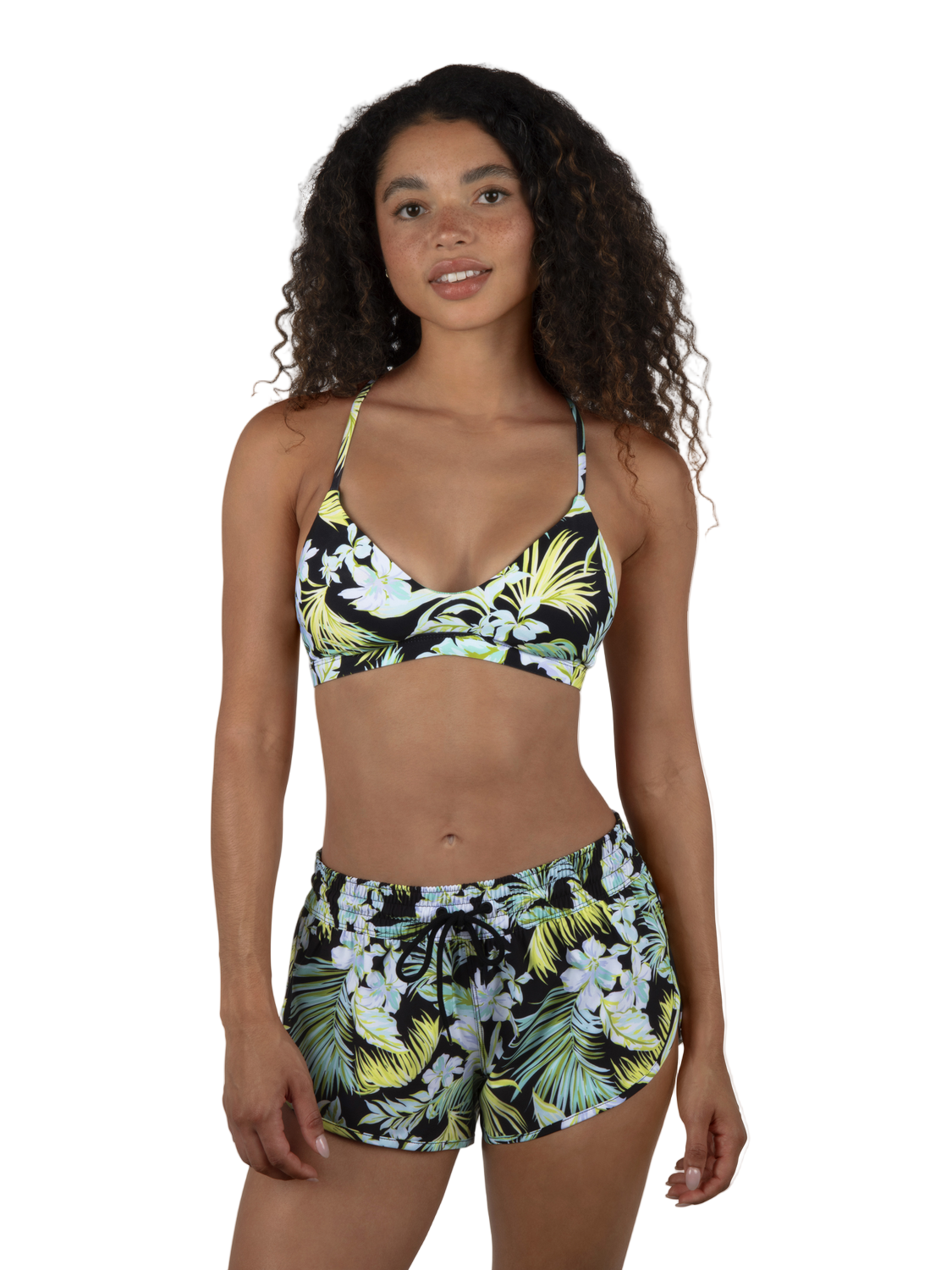 Woman wearing a tropical print bikini set on a white background