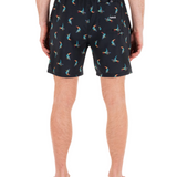 Person wearing black shorts with colorful flamingo pattern on a white background