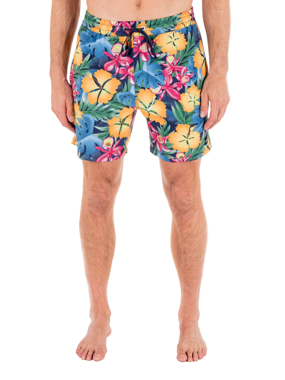 Person wearing colorful floral swim shorts on a white background