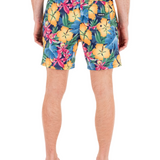 Colorful floral-patterned shorts worn by a person on a white background
