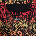 Multicolored tiger patterned fabric with a Hurley logo on a black background