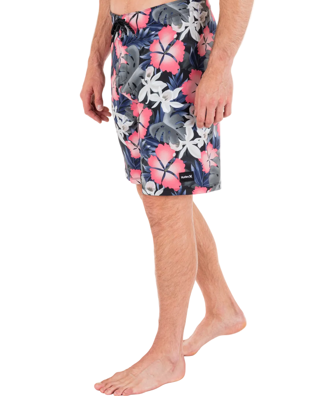 Person wearing a floral patterned swimsuit on a white background