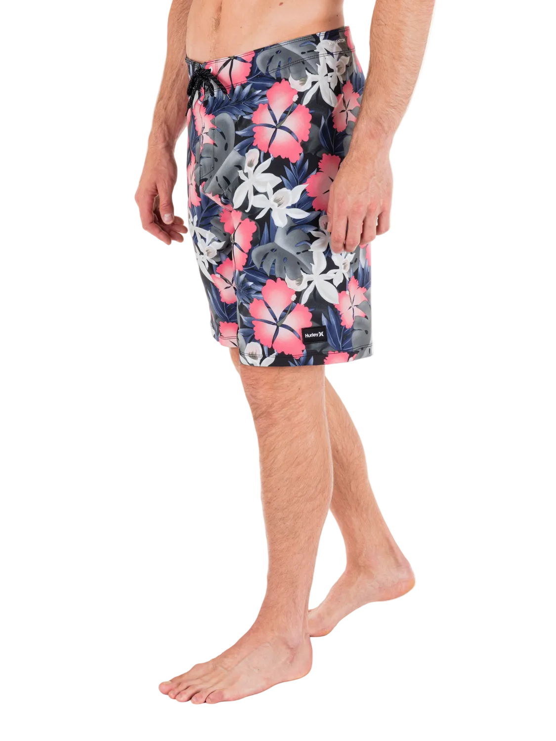 Person wearing a floral patterned swimsuit on a white background