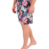 Person wearing a floral patterned swimsuit on a white background