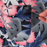 Close-up of a floral-patterned shirt with a graphic and Hurley logo.