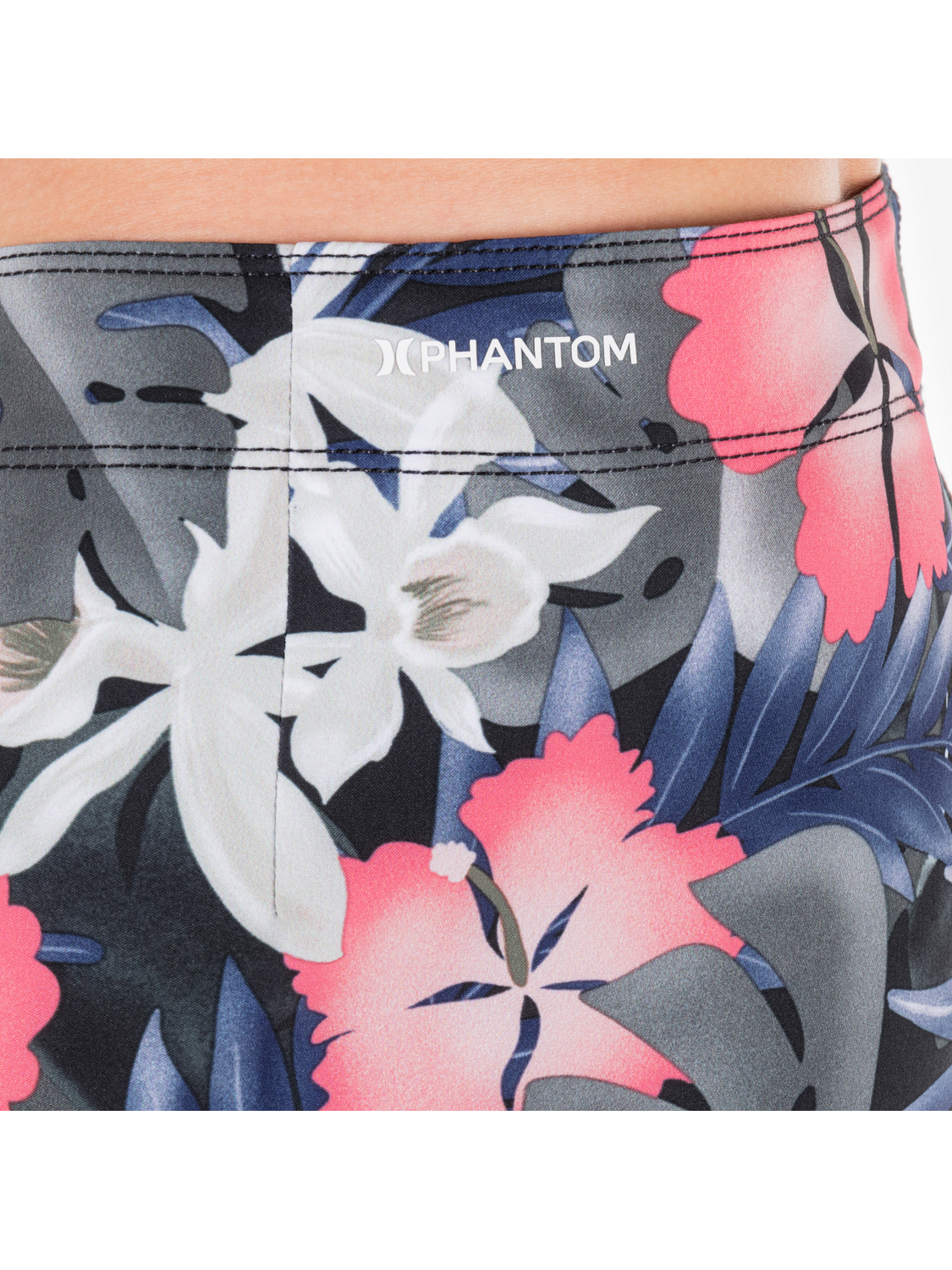 Tropical floral patterned shorts with 'PHANTOM' branding on a white background