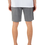 Person wearing gray shorts on a white background
