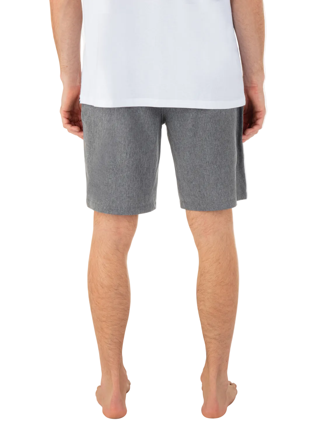 Person wearing gray shorts on a white background