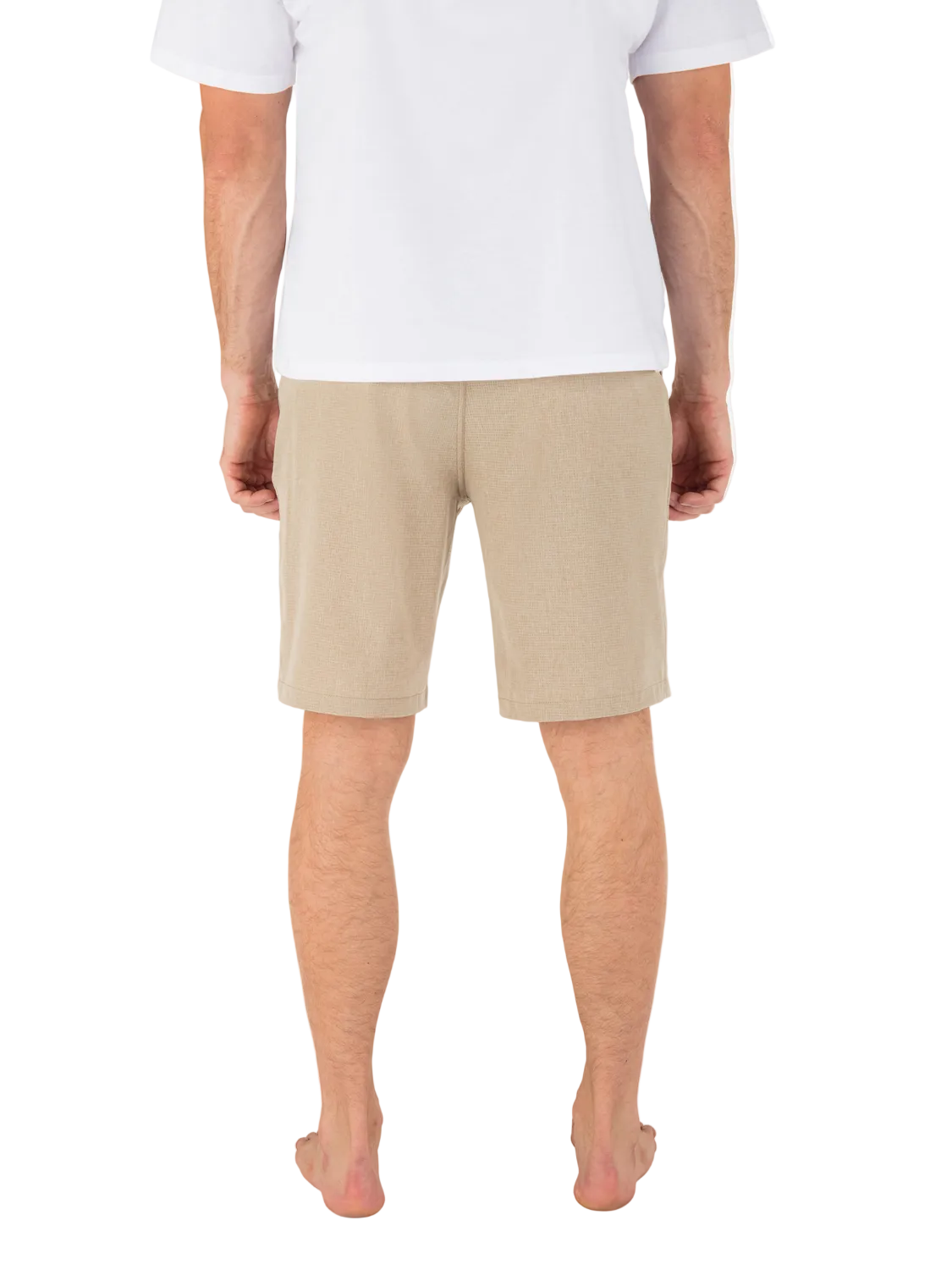 Person wearing beige shorts and a white shirt on a white background