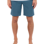 Person wearing blue shorts on a white background