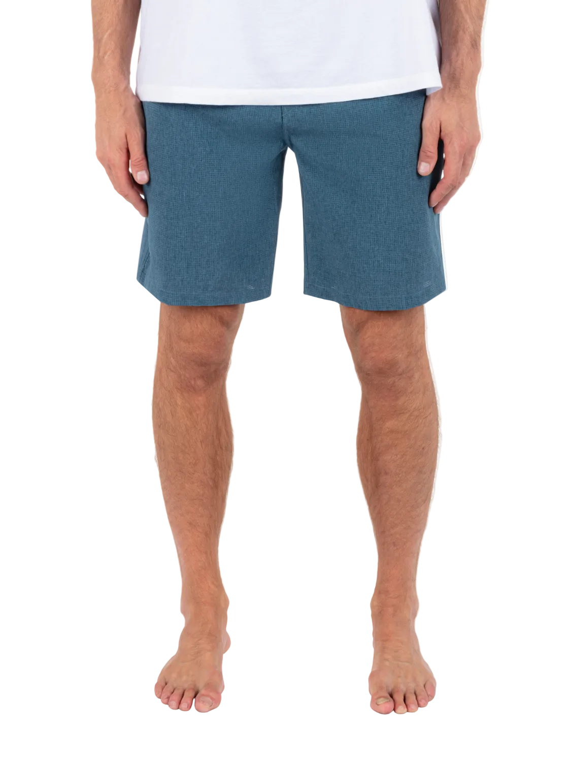 Person wearing blue shorts on a white background