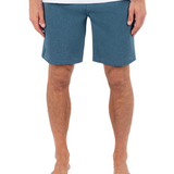 Person wearing blue shorts on a white background