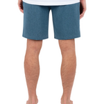 Person wearing blue shorts on a white background
