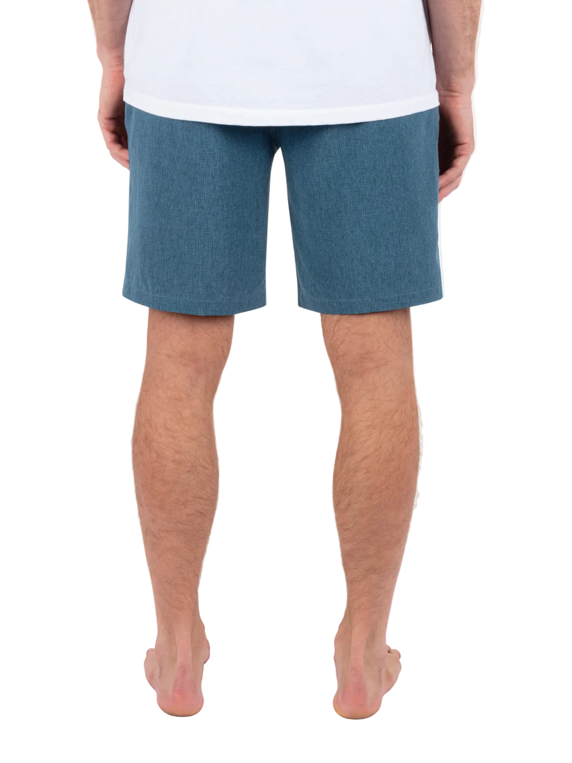 Person wearing blue shorts on a white background