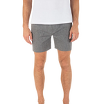 Person wearing gray shorts and a white shirt on a white background