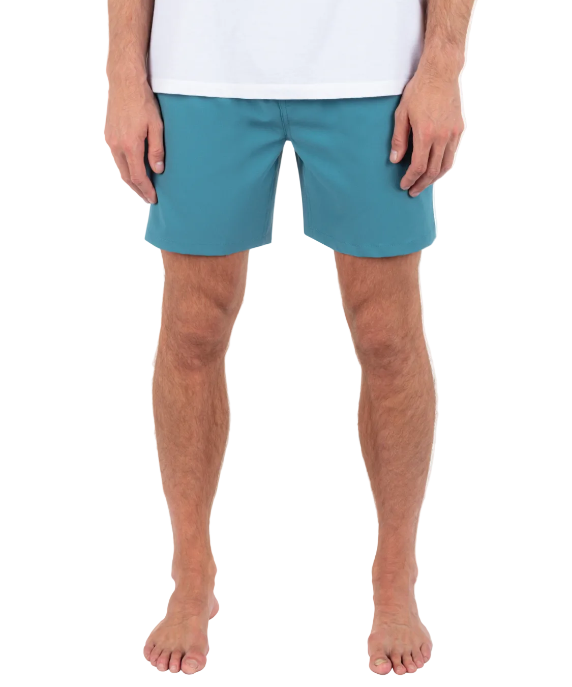 Person wearing teal shorts on a white background
