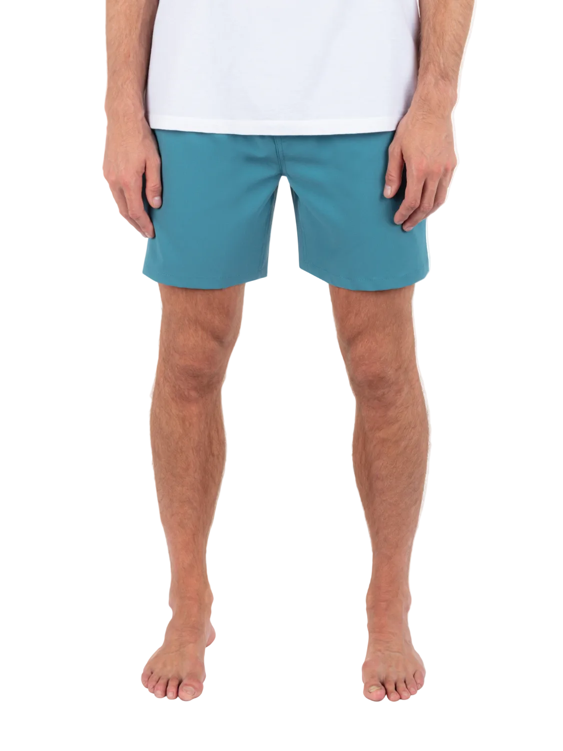 Person wearing teal shorts on a white background