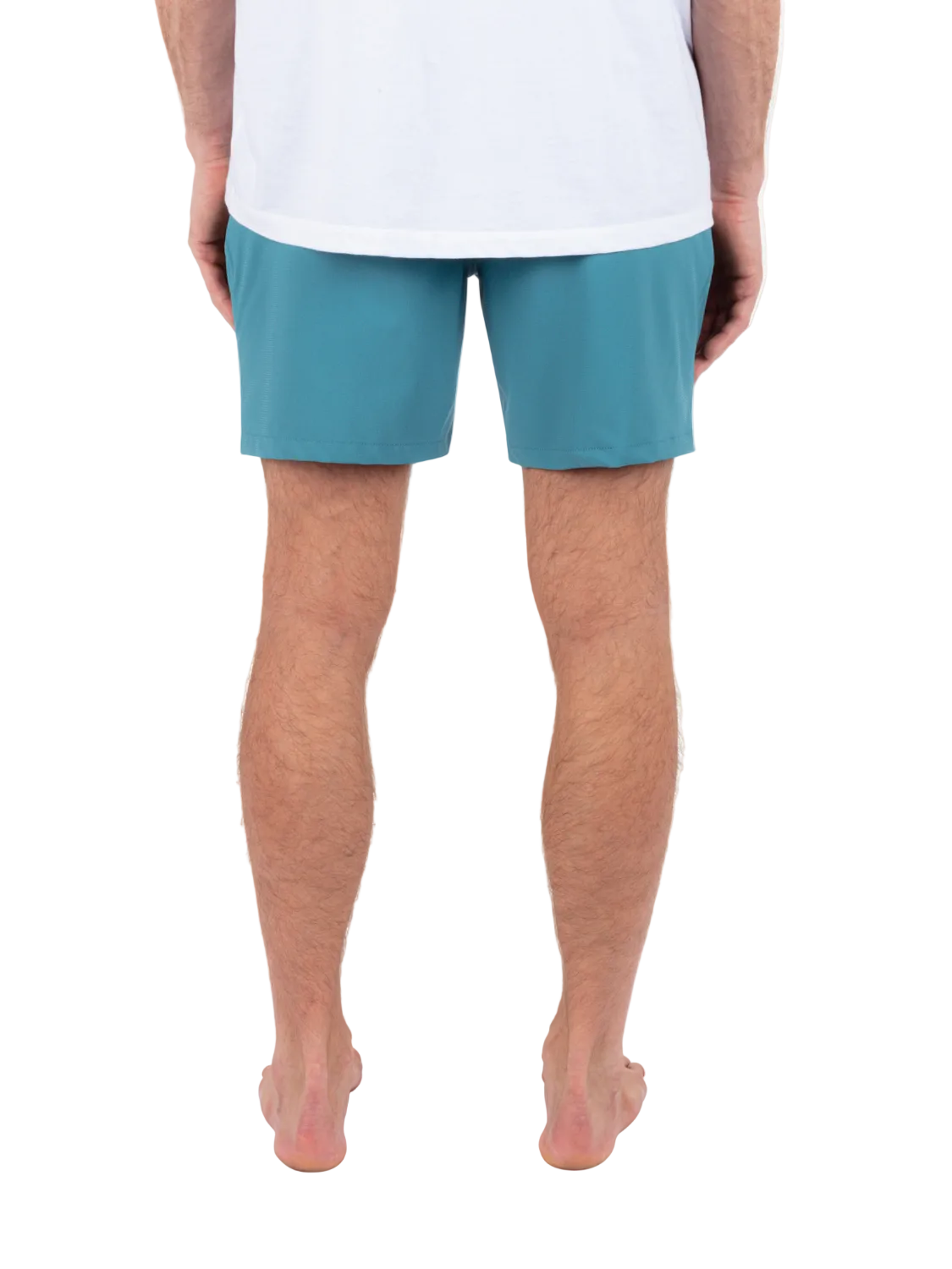 Person wearing teal shorts on a white background