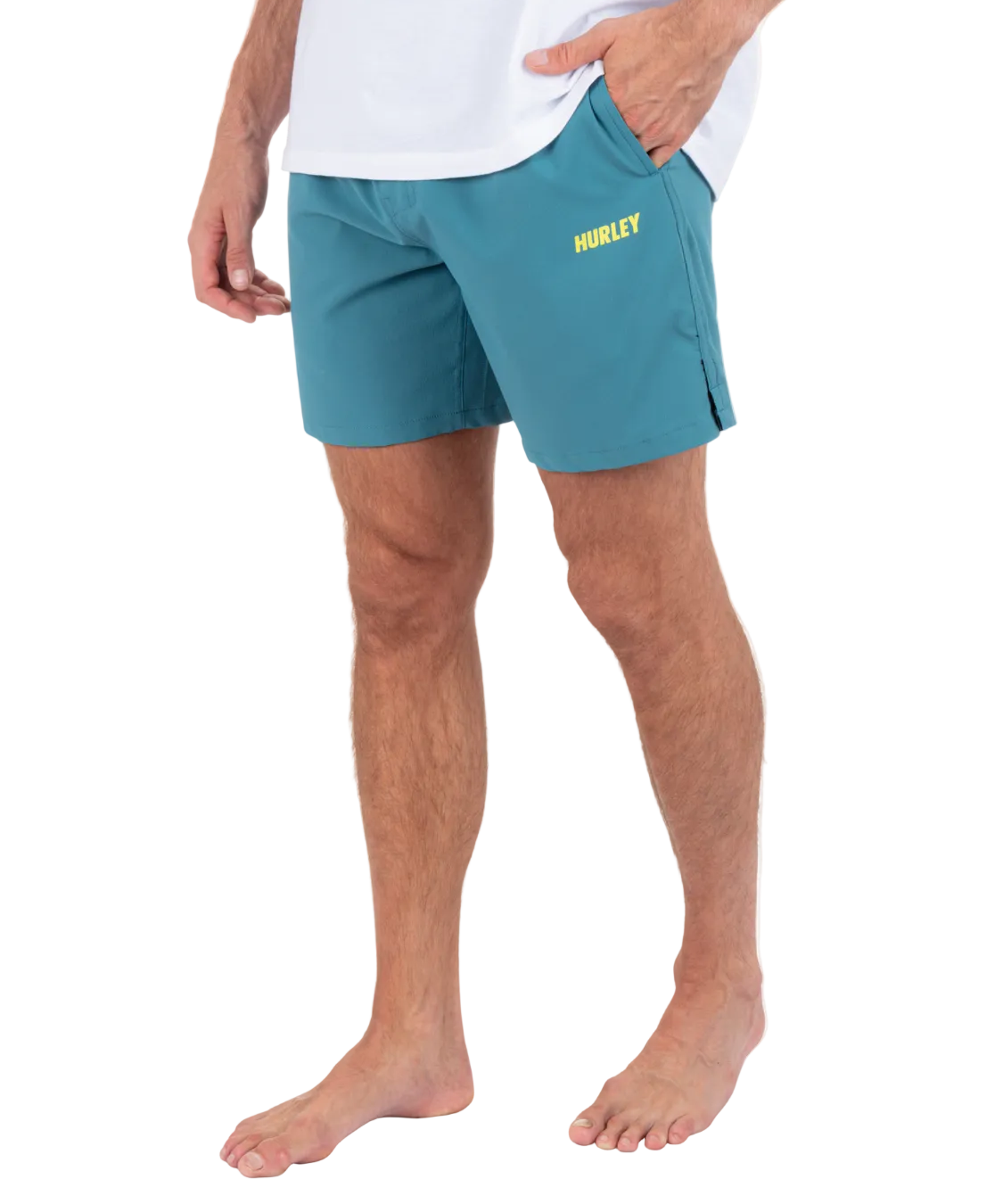 Person wearing teal Hurley shorts on a white background