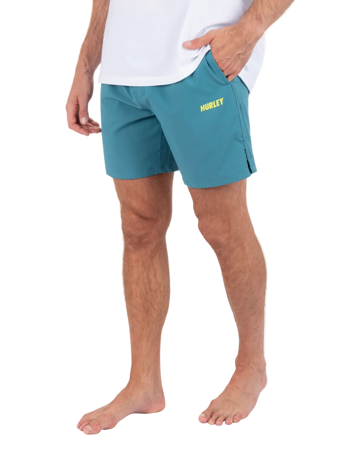 Person wearing teal Hurley shorts on a white background