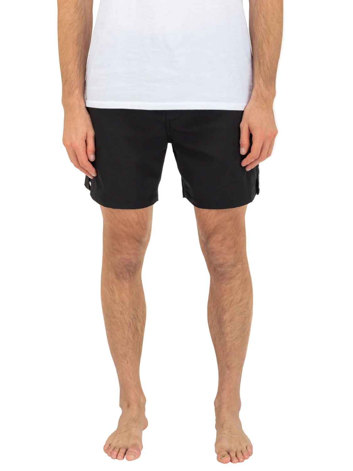 Person wearing black shorts and a white shirt on a white background