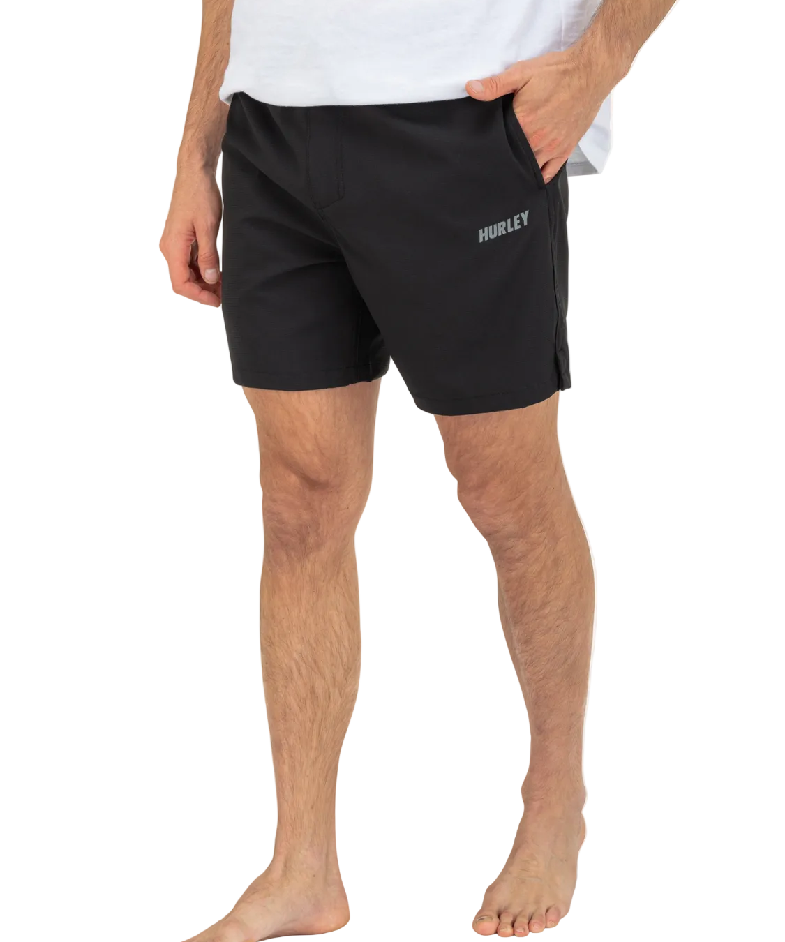 Person wearing black Hurley shorts on a white background