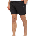 Person wearing black Hurley shorts on a white background