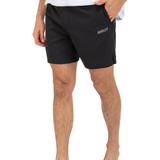 Person wearing black Hurley shorts on a white background