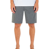 Person wearing gray shorts on a white background