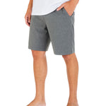 Person wearing gray shorts and a white shirt on a white background