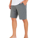 Person wearing gray shorts and a white shirt on a white background