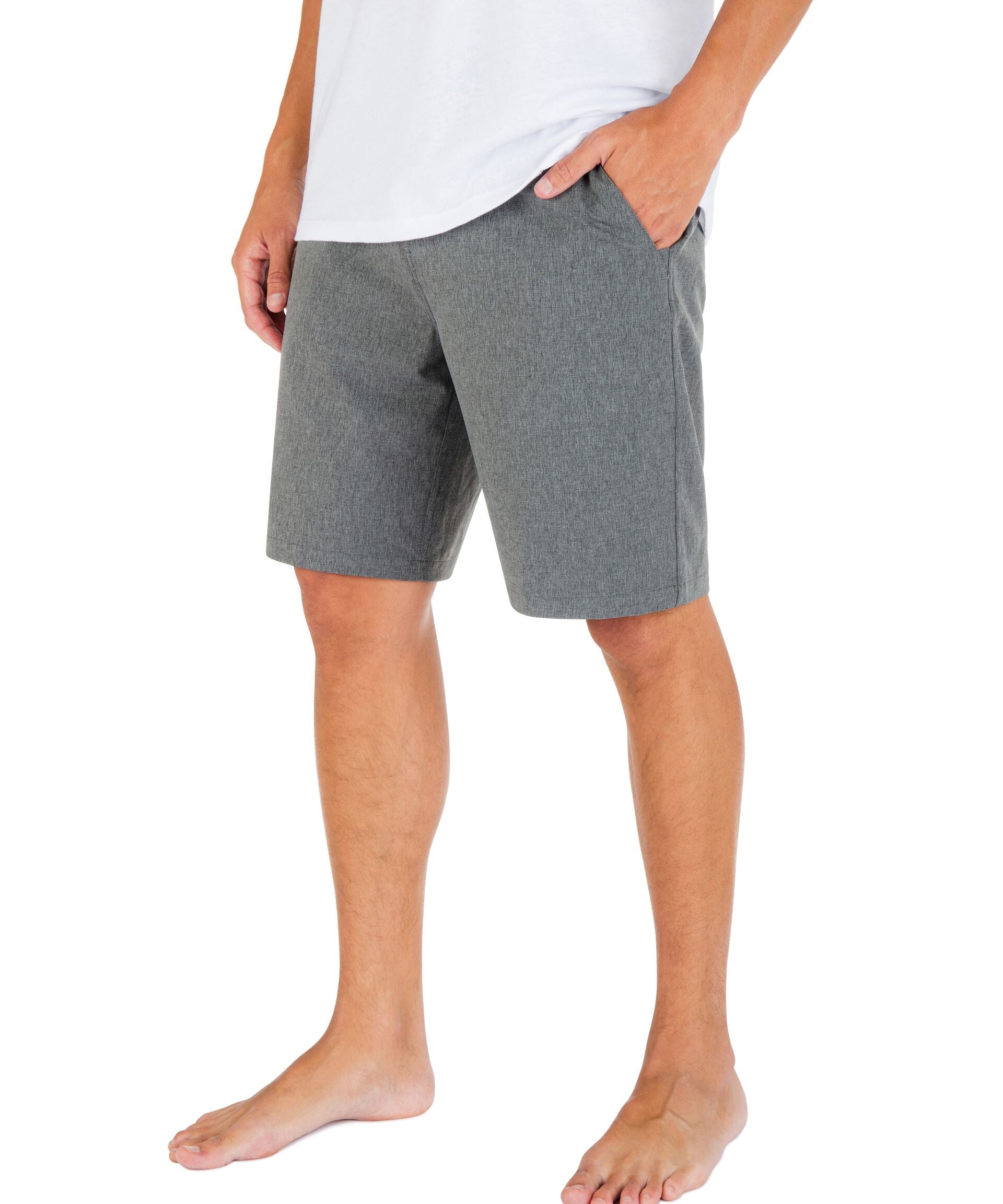Person wearing gray shorts and a white shirt on a white background