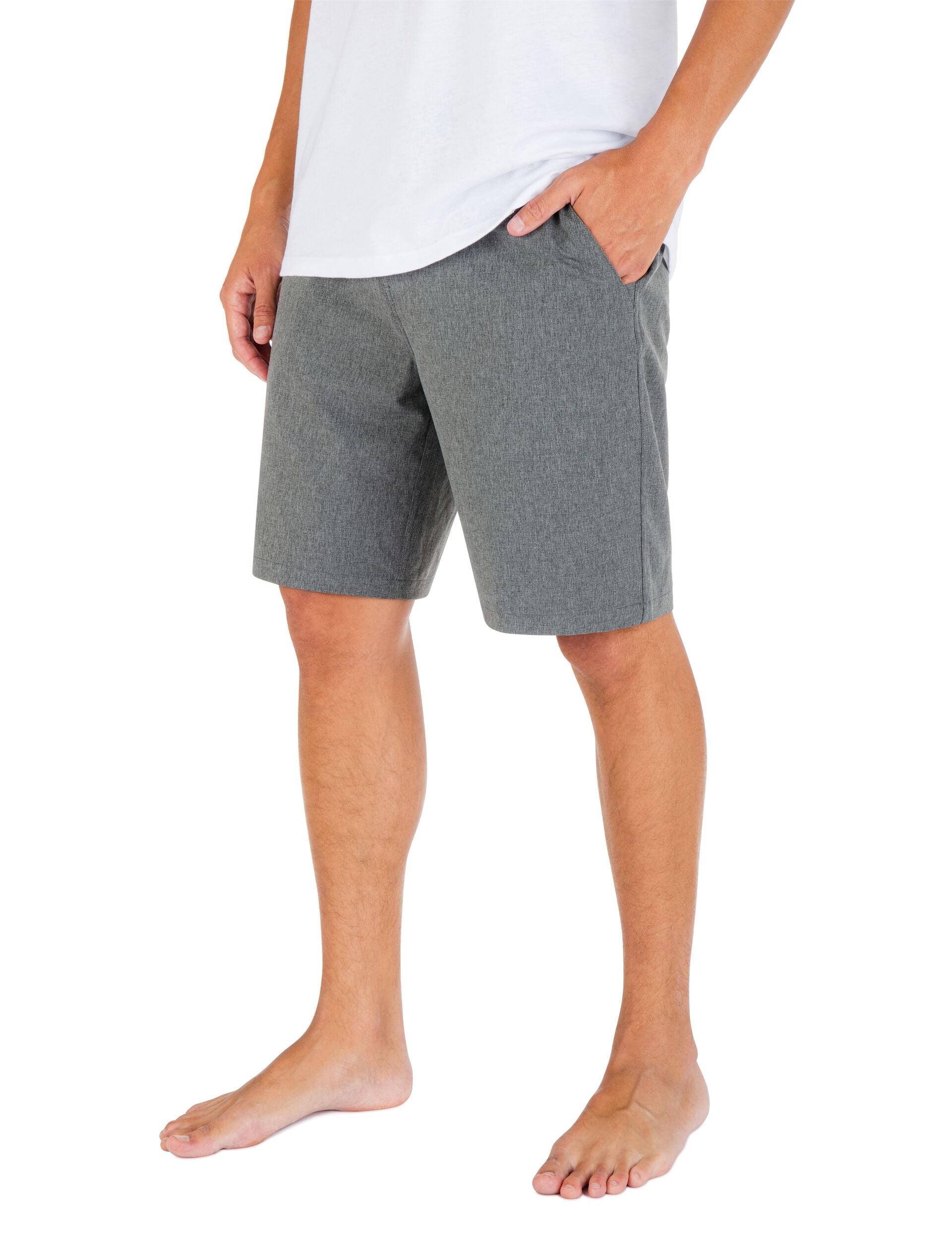 Person wearing gray shorts and a white shirt on a white background
