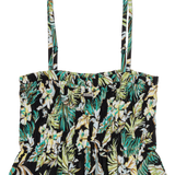 Tropical patterned top with thin straps on a white background