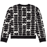 Black and white patterned sweater on a white background